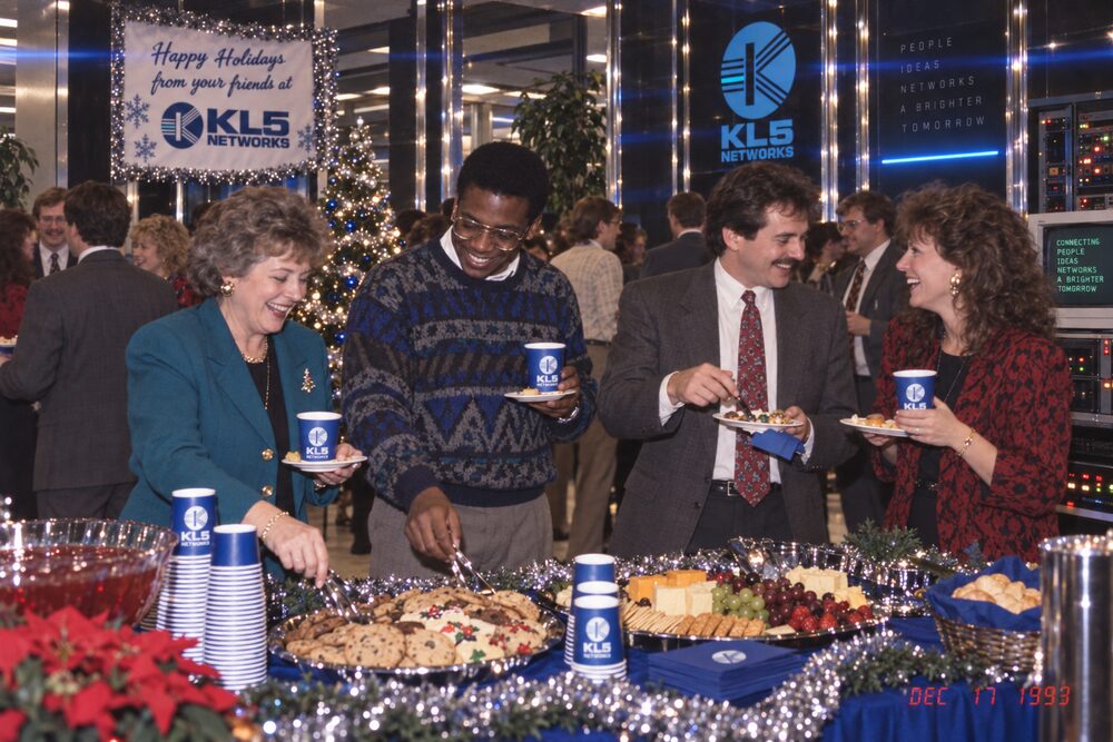 Staff gathered around the buffet table
