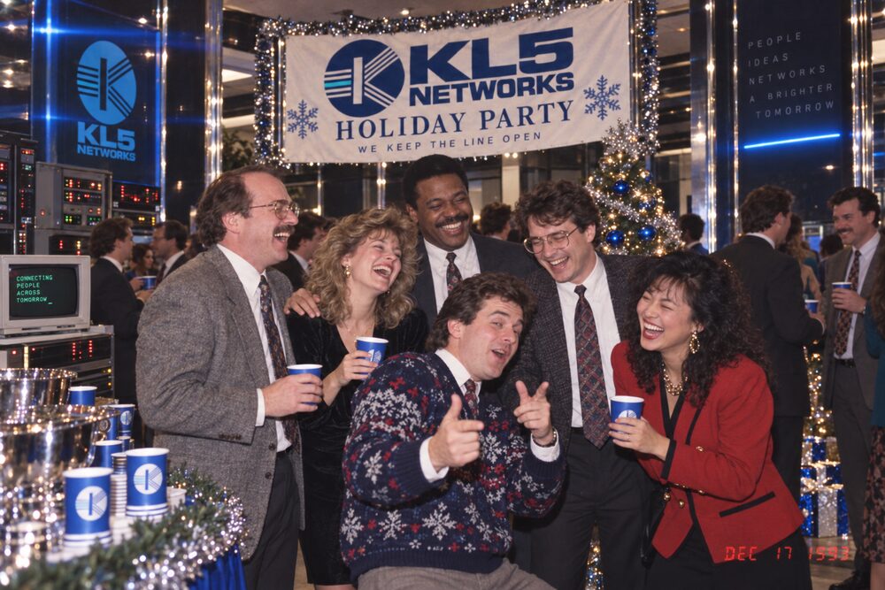 A group raising branded cups in a toast